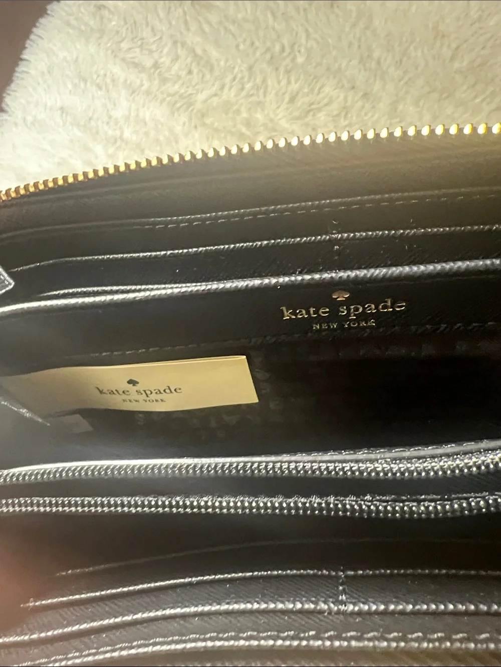 kate spade Black Zip-Around Logo Plate Wallet
